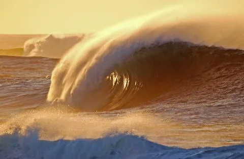 Wave in sunset Stock Photos