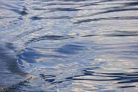 A wave on the surface of the water behind the ship Stock Photos