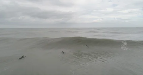 Wave with surfers Stock Footage 129967768