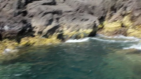 Wave swells over rocks2 1 Stock Footage 7756846