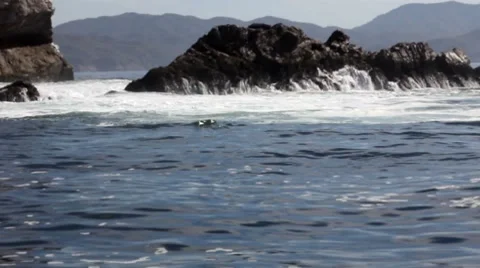 Wave swells over rocks4 1 Stock Footage 7753642