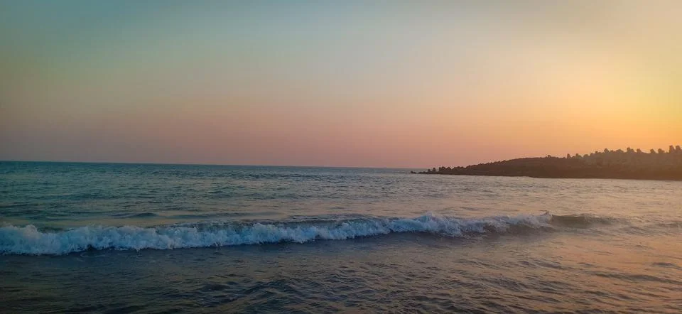 Wave at the time of sunset Stock Photos