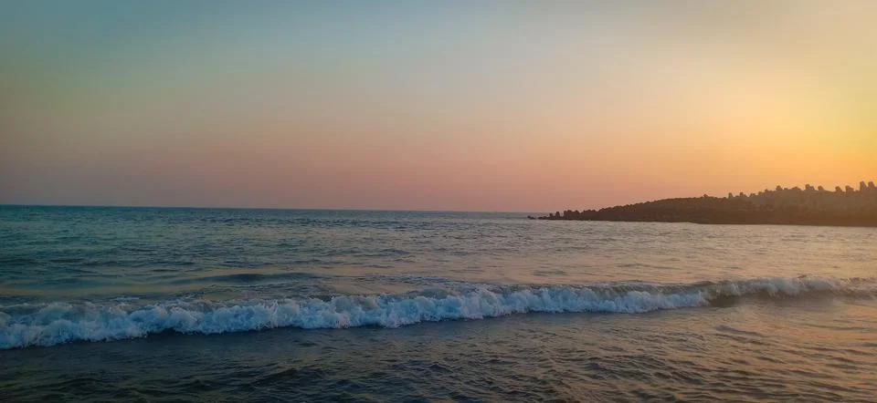 Wave at the time of sunset Stock Photos