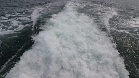Wave trail surface behind a ferry boat in sea Stock Footage 79131142