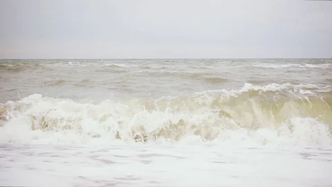 Wave is twisted with sand slow mo Stock Footage 83127805