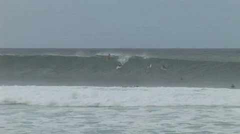 Wave vs surfer Motion JPEG Stock Footage 800443