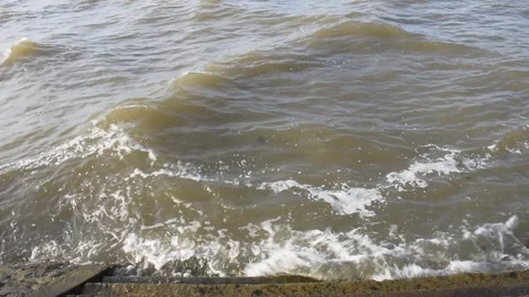 The wave washed ashore into the port of cement Stock Footage 129209547