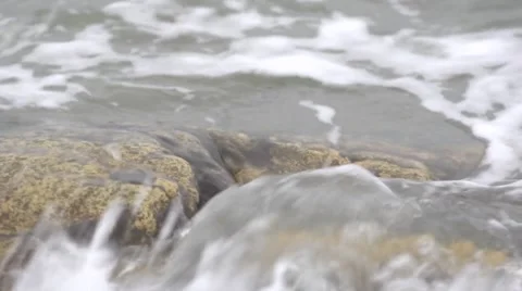 A wave washes stone closeup. Stock Footage 53046479