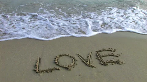 Wave washing love Stock Footage 64408775
