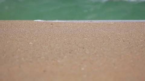 Wave washing sandy beach. Stock Footage 70878428