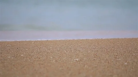 Wave washing sandy beach. Stock Footage 70878584