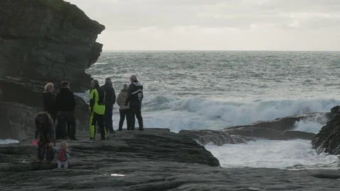 Wave Watching at High Water at the rocky gully of Trebarwith Strand Stock Footage 86486341