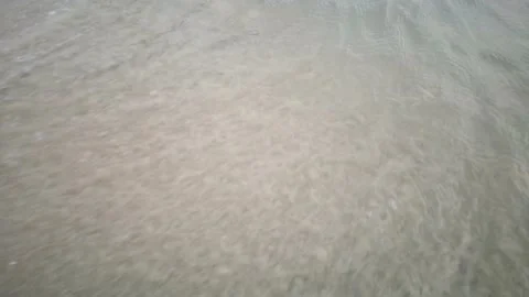 Wave water with sand on the beach Video stock 135789326