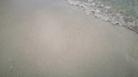 Wave water with sand on the beach Stock Footage 135789388