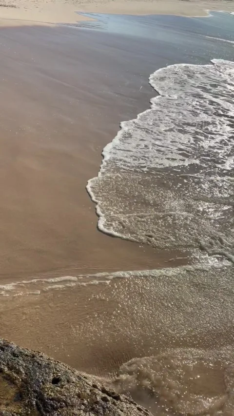 A Wave on a Wide Beach Stock Footage 324760912