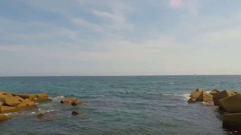Wavebreaker At Sea Artificial Rocks Stock Footage 77000175