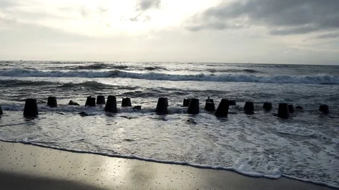 Wavebreakers on Baltic Sea coast  sea pan shot Stock Footage 92078475