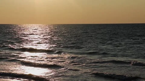 A Waved Sea In The Rays Of Sunset And The Orange Horizon Stock Footage 160864997