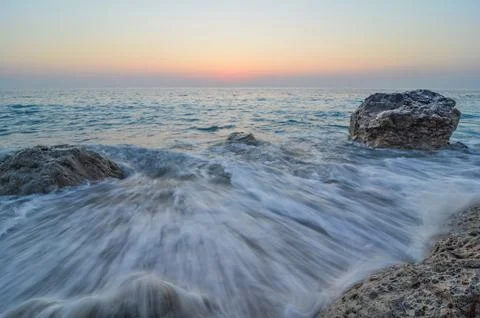 Waves after sunset Stock Photos