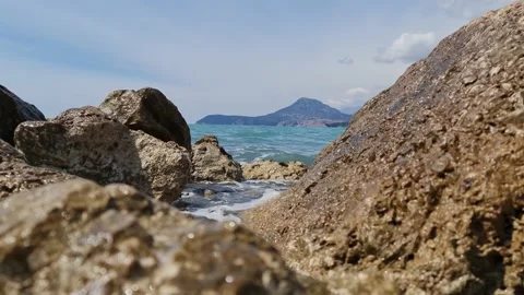 Waves against the background of mountains and sky Stock Footage 183817625