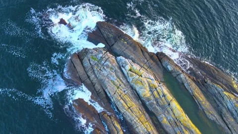 Waves Against Big Rock 4K Areal Stock Footage 249907837