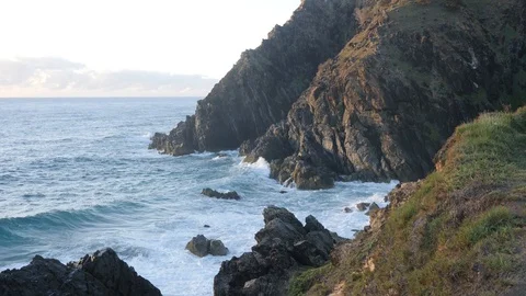 Waves Against Ocean Cliffs at Dawn Video stock 90540736