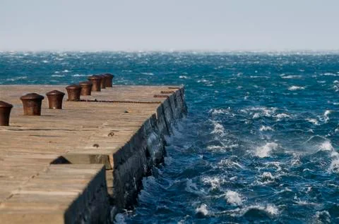 Waves against pier Stock Photos