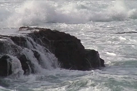 Waves against rocks Stock Footage 117422