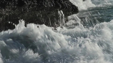 Waves Against rocks Stock Footage 33391496