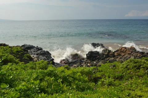 Waves Against Rocks Stock Photos