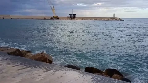 Waves along the seafront Stock Footage 272605943