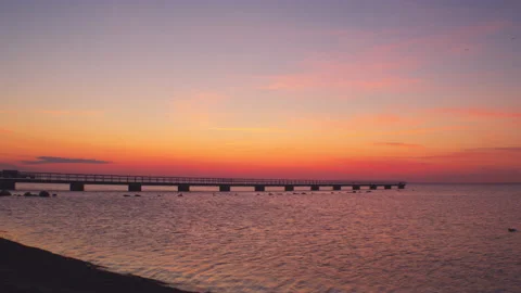 Waves Along Shore With Pier At Sunset Stock-Footage 201324910