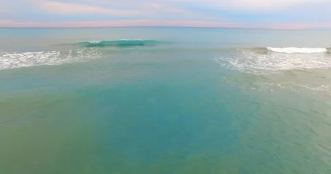 Waves with Amazing Sunset Background, 4k Drone Shot Stock Footage 149864417