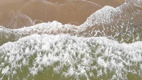 Waves and beach looked from above Stock Footage 97601622
