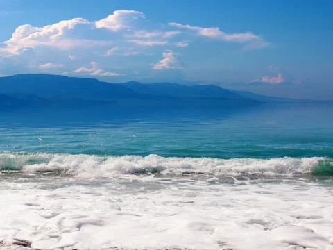 Waves and beach Stock Photos