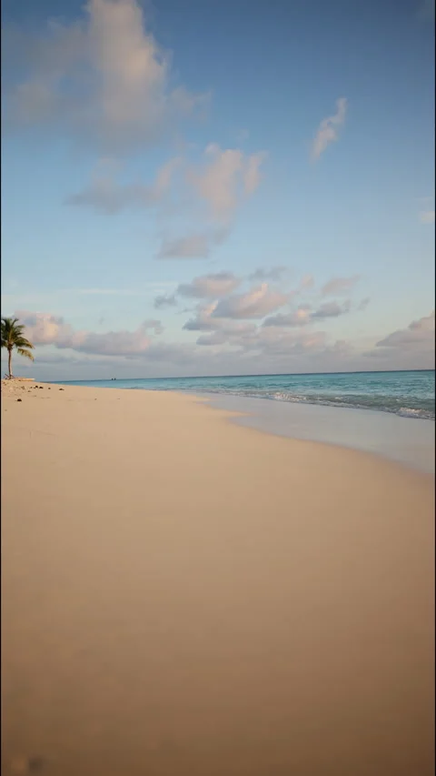 Waves and a beach at sunset in the Maldives. Vertical footage Stock Footage 260340729