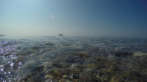 Waves and blue sky at a beach Stock Footage 67898272