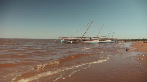Waves and boats Stock Footage 73660433