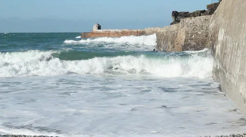Waves and bodyboarder Portreath pier Stock Footage