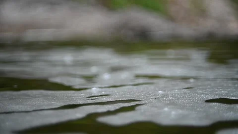 Waves and bubbles move in a pool of a mountain river (slow motion, bokeh) 스톡 동영상 212755132