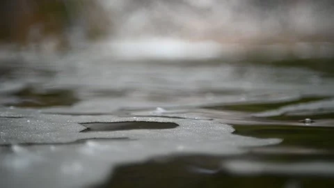 Waves and bubbles move in a pool of a mountain river (bokeh, slow motion) Stock-Footage 212755263