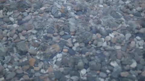 Waves and clear water. Through the water are visible stones. Rivers, lakes and Stock Footage 60114862