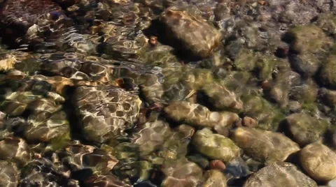 Waves and clear water. Through the water are visible stones. Stock Footage 63361776