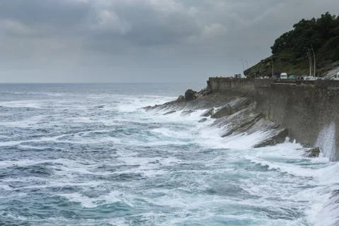 Waves and clouds in the coast. Stock Photos