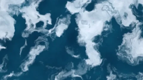 Waves and clouds create a pattern on a blue ocean surface Video stock 338300925