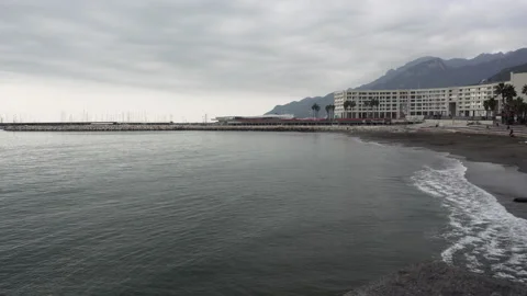 Waves and flying seagulls on the winter beach in Salerno in Italy Stock Footage 133158987