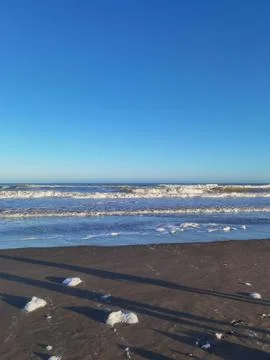 Waves and foam on the coast of the Atlantic Ocean Argentina Stock Photos
