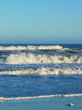 Waves and foam on the coast of the Atlantic Ocean Argentina Stock Photos