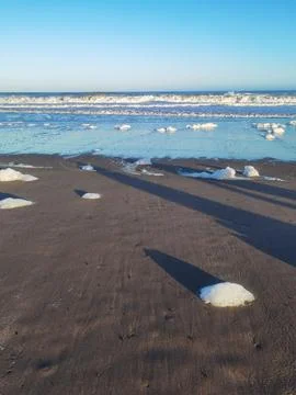 Waves and foam on the coast of the Atlantic Ocean Argentina Stock Photos