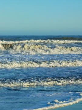 Waves and foam on the coast of the Atlantic Ocean Argentina Stock Photos